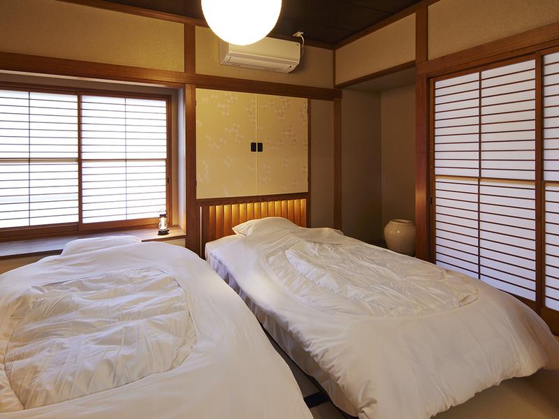 マイグレ600 1F石庭 心落ち着く和のベッドルーム。最大5名様ご宿泊可能です。